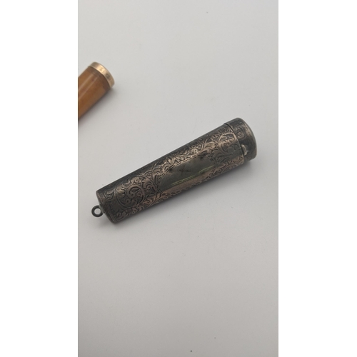 233 - Smoking related items to include an amber and 9ct gold cheroot, together with silver cheroot case wi... 