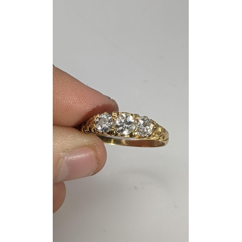 250 - A Victorian gold and three stone diamond ring tested as 22ct gold size T, 3.4g Location:RING
If ther... 