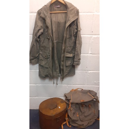 460 - A vintage canvas ,leather and metal framed backpack together with an early 20th Century tin hat box ... 