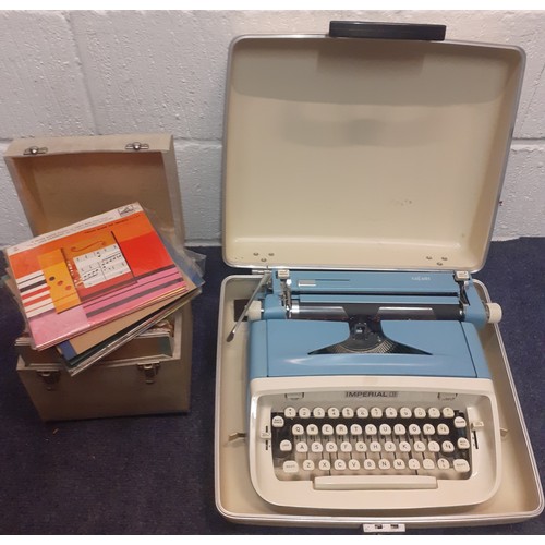 440 - A vintage cased Imperial Safari typewriter in cream and blue together with a small quantity of 1960'... 