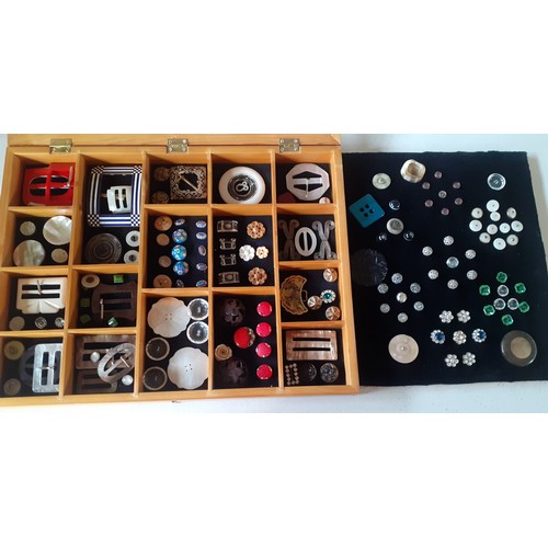 493 - A pine tabletop display case with partitions artistically filled with mounted vintage buttons and bu... 