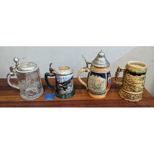 497 - A mixed lot to include a large collection of beer steins to include several German style ceramic exa... 