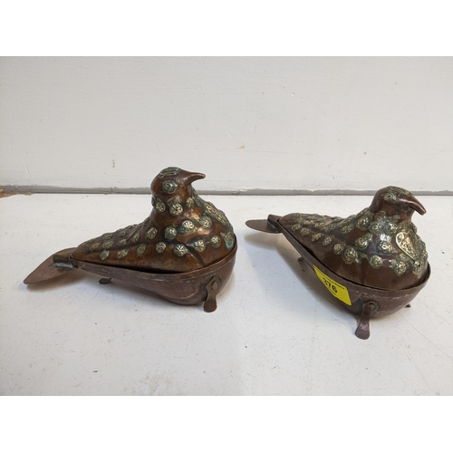 376 - Two Indo-Persian copper incense containers in the form of birds having white metal decorative mounts... 