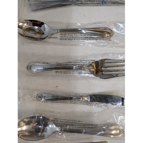 383 - A Lenox Chandelle 45-piece stainless steel cutlery set, and other flatware to include sets of knives... 