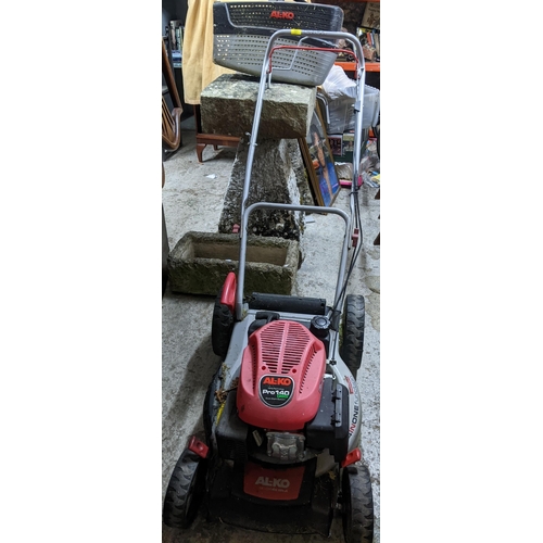 389 - An AL-KO Pro 140 QSS petrol lawnmower with grass box Location: G
If there is no condition report sho... 