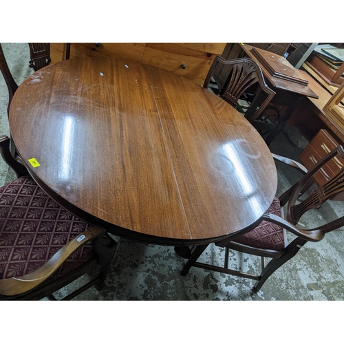 390 - A Victorian pedestal extending mahogany dining table with two extra leaves, and four later Hepplewhi... 