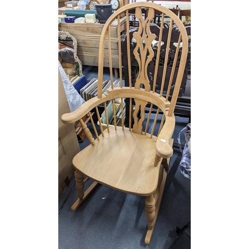 427 - A vintage beech Windsor rocking chair having pierced splat back and spindle supports
Location:A1F
If... 