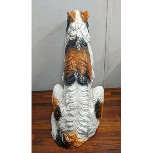 432 - A life size Italian ceramic floor standing statue/figure of a rough collie in a seated position, 73.... 