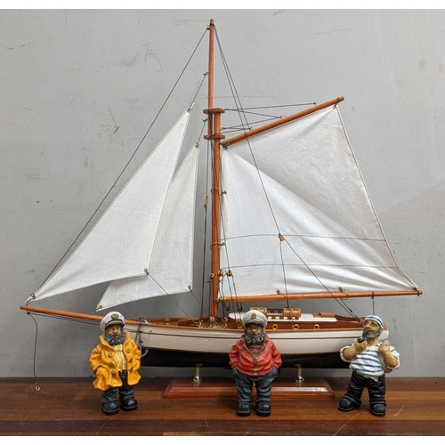 438 - A model of a yacht together with three nautical figures, 52cm h
Location:RAM
If there is no conditio... 