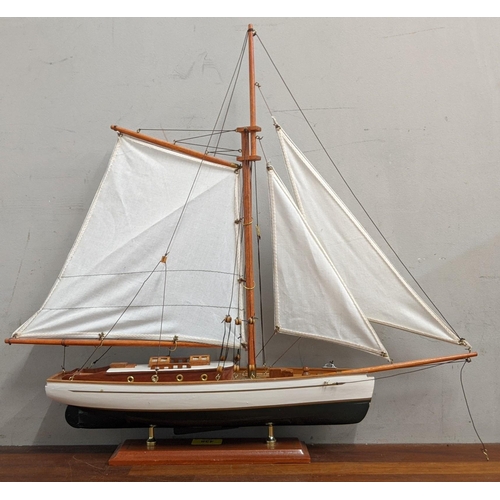 438 - A model of a yacht together with three nautical figures, 52cm h
Location:RAM
If there is no conditio... 