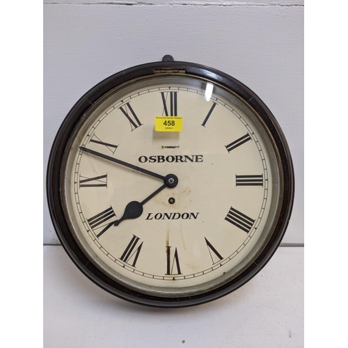 458 - An Osborne wall clock with London underneath in an oak case with a roman dial and a white face (two ... 