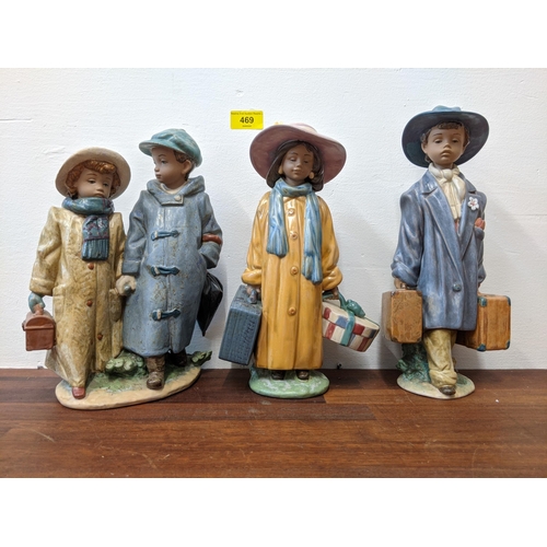 469 - Three Lladro figures, one of a boy holding two suitcases, the other of a girl holding a suitcase and... 