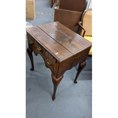 471 - An 18th century oak lowboy with three drawers on cabriole legs Location:LAB
If there is no condition... 