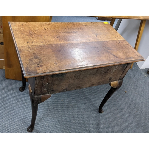 472 - An 18th century oak lowboy with three drawers on cabriole legs Location:A4M
If there is no condition... 