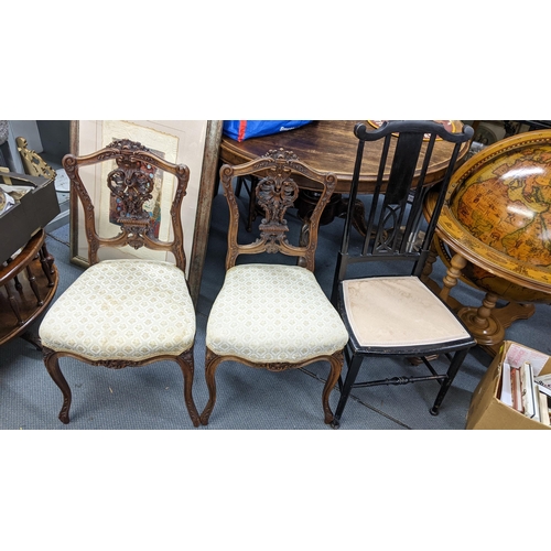 473 - A pair of late 19th century French carved walnut salon chairs, an ebonized chair, and a mahogany sto... 