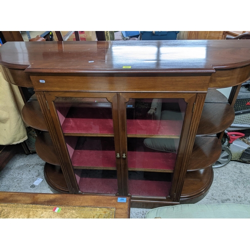 474 - A 20th century mahogany display side cabinet, twin glazed doors showing internal shelves, flanked by... 