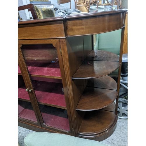 474 - A 20th century mahogany display side cabinet, twin glazed doors showing internal shelves, flanked by... 