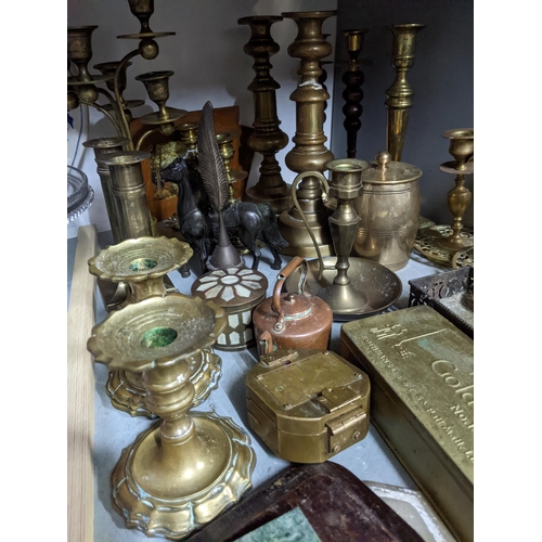 502 - A selection of mixed brassware to include pairs of candlesticks, a leather box with gold coloured co... 