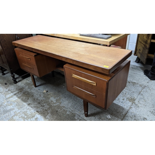 478 - A mid-century G-Plan Fresco dressing table with a central drawer, flanked by pedestals with two draw... 