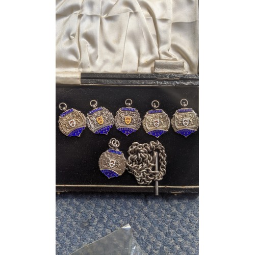 407 - A mixed lot of interest to include a cased set of 5 silver school medals and chain, a piece of cloth... 