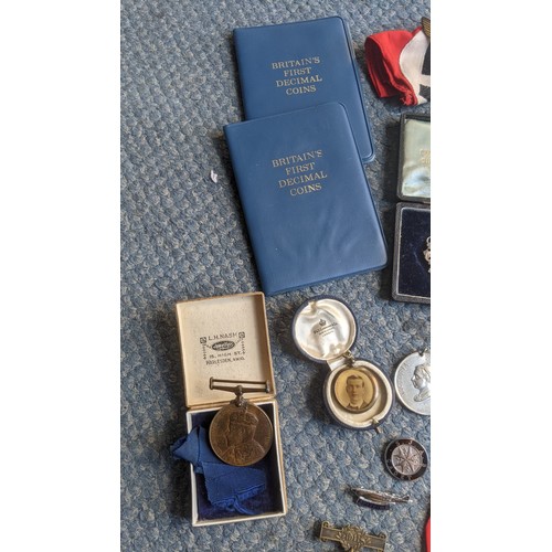 407 - A mixed lot of interest to include a cased set of 5 silver school medals and chain, a piece of cloth... 