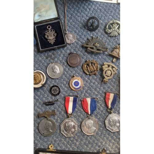 407 - A mixed lot of interest to include a cased set of 5 silver school medals and chain, a piece of cloth... 