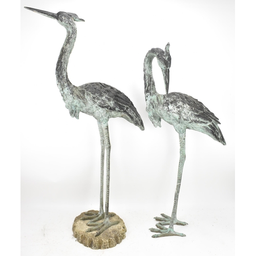 104 - Two 20th century large light green patinated cast bronze models of cranes, one mounted on a naturali... 