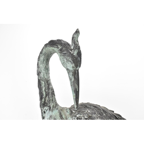 104 - Two 20th century large light green patinated cast bronze models of cranes, one mounted on a naturali... 