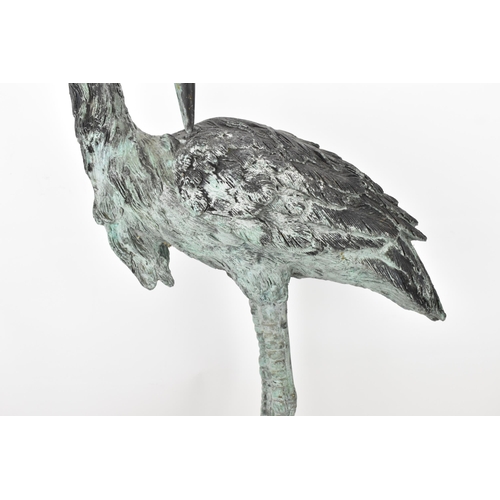 104 - Two 20th century large light green patinated cast bronze models of cranes, one mounted on a naturali... 