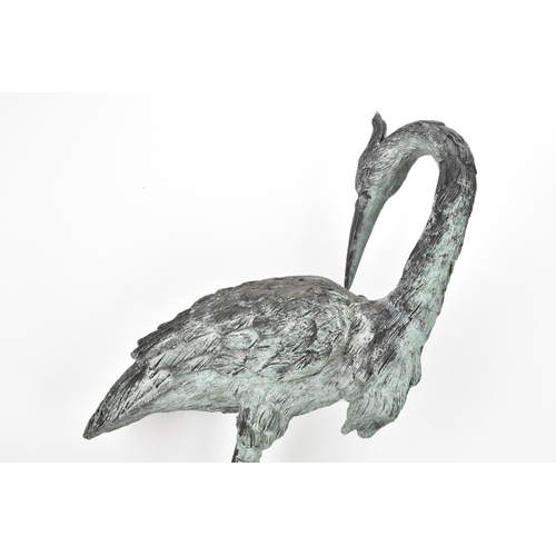 104 - Two 20th century large light green patinated cast bronze models of cranes, one mounted on a naturali... 