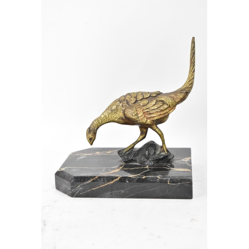 106 - After Antonio Amorgasti - A pair of 1930s bookends fashioned as gilded bronze models of pheasants on... 