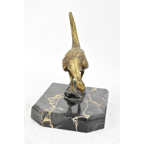 106 - After Antonio Amorgasti - A pair of 1930s bookends fashioned as gilded bronze models of pheasants on... 