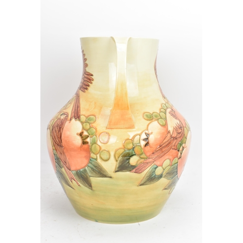 11 - A Moorcroft pottery large and impressive 'Finches Ochre' pattern twin handled vase, designed by Sall... 