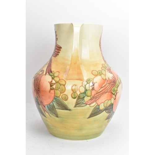 11 - A Moorcroft pottery large and impressive 'Finches Ochre' pattern twin handled vase, designed by Sall... 