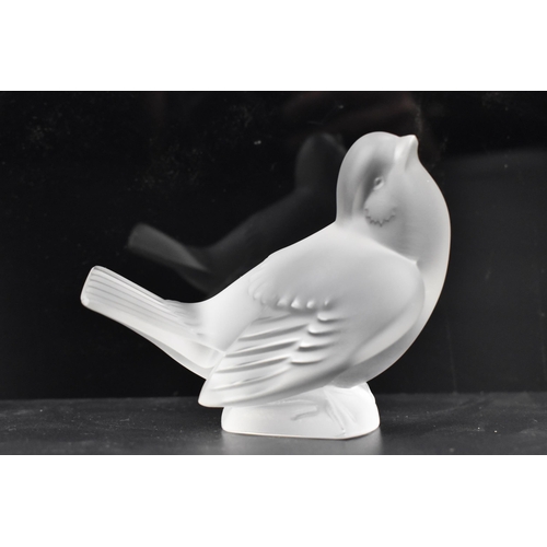 112 - A Lalique 'Moineau Moqueur' frosted glass paperweight fashioned as sparrow, signed 'Lalique France' ... 