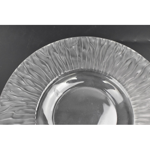 113 - A late 20th century Lalique glass bowl, having a stylised sunburst moulded rim, etched signature 'La... 