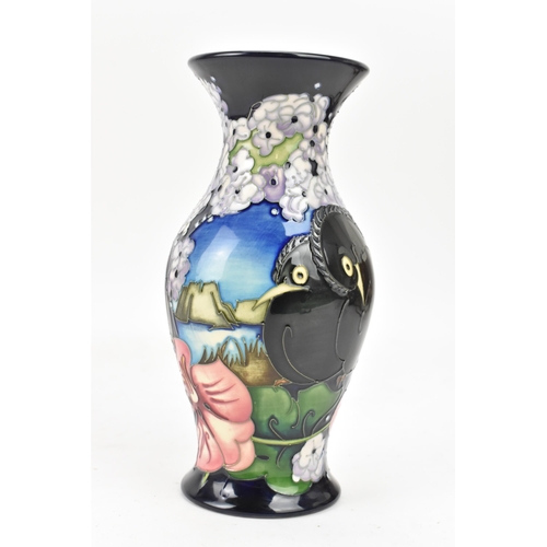 12 - A Moorcroft pottery trial piece seconds quality vase, of baluster form, decorated with birds in a co... 