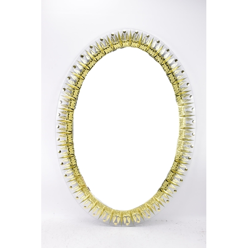 122 - A 1960s Italian Cristal Art 'Ears Of Wheat' mirror, of oval form with repeating gilt motifs surround... 