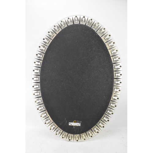 122 - A 1960s Italian Cristal Art 'Ears Of Wheat' mirror, of oval form with repeating gilt motifs surround... 