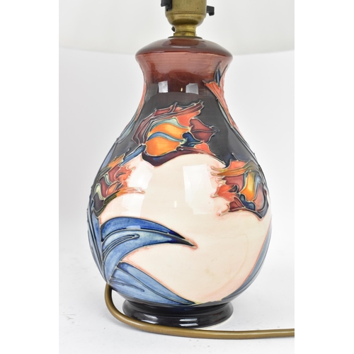 15 - A pair of Moorcroft pottery 'Red Tulips' pattern table lamps, designed by Sally Tuffin, each of balu... 