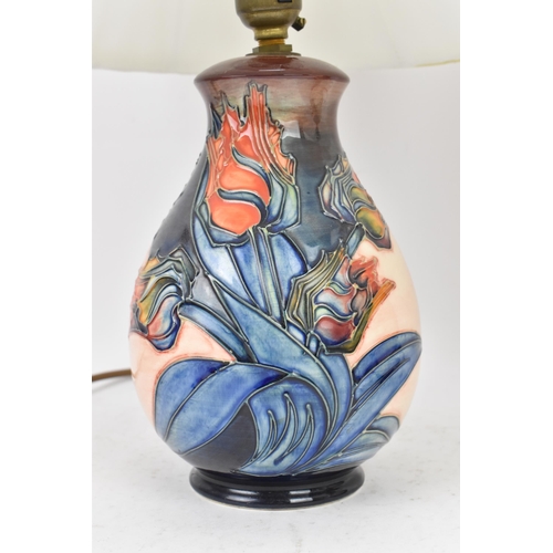 15 - A pair of Moorcroft pottery 'Red Tulips' pattern table lamps, designed by Sally Tuffin, each of balu... 