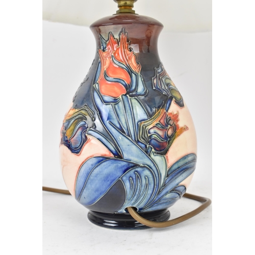 15 - A pair of Moorcroft pottery 'Red Tulips' pattern table lamps, designed by Sally Tuffin, each of balu... 