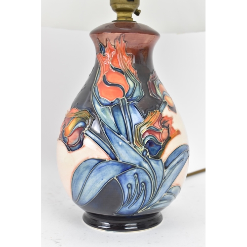 15 - A pair of Moorcroft pottery 'Red Tulips' pattern table lamps, designed by Sally Tuffin, each of balu... 