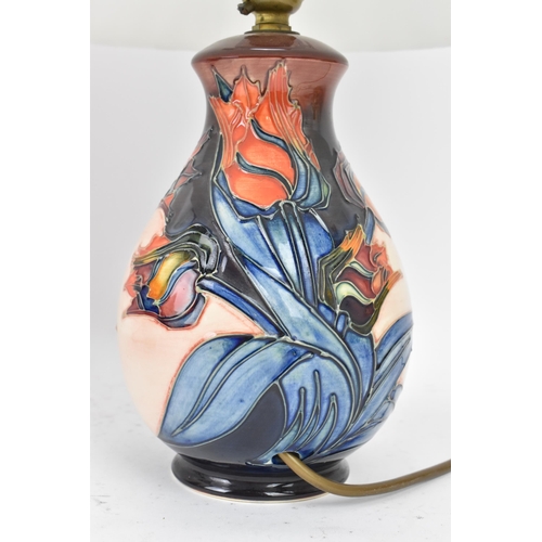 15 - A pair of Moorcroft pottery 'Red Tulips' pattern table lamps, designed by Sally Tuffin, each of balu... 