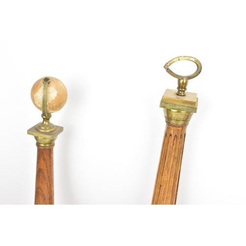 151 - Four early 20th century Masonic oak columns, two mounted with globes, each having a tapered column a... 