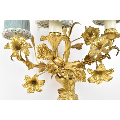 152 - A 19th century Louis XV style ormolu and marble table lamp, converted from a candelabrum, fashioned ... 