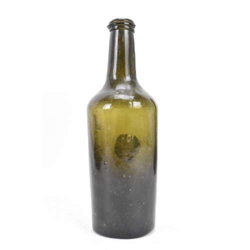 154 - An early 19th century glass seal wine bottle, the tapering neck with sloping rim, the cylindrical bo... 