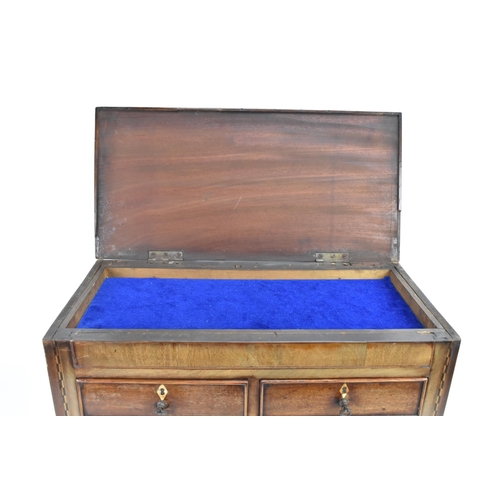 164 - A 19th century mahogany inlaid traders sample chest of two short and three long drawers, having a hi... 