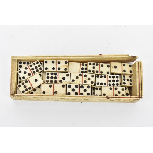 167 - A 19th century French prisoner of war bone domino set, the case sarcophagus formed with a sliding pa... 