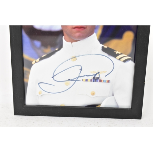 173 - A Tom Cruise signed colour photograph, the image depicting the actor in costume as Maverick from the... 